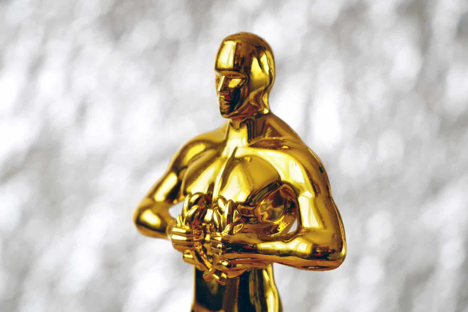 Hollywood Golden Oscar Academy award statue on silver background