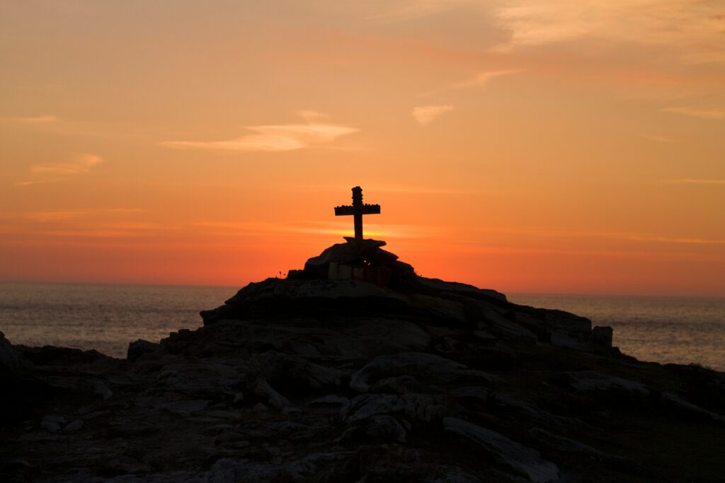 A Cross perched on the Cliffs of Malin Head, Co. Donegal, Ireland. A Memorial to a young french man who drowned off the coast.