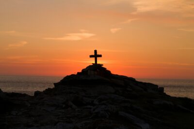 A Cross perched on the Cliffs of Malin Head, Co. Donegal, Ireland. A Memorial to a young french man who drowned off the coast.